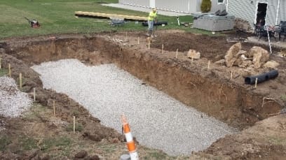 fiberglass pool hole with gravel base foundation
