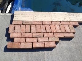 pavers around an inground swimming pool